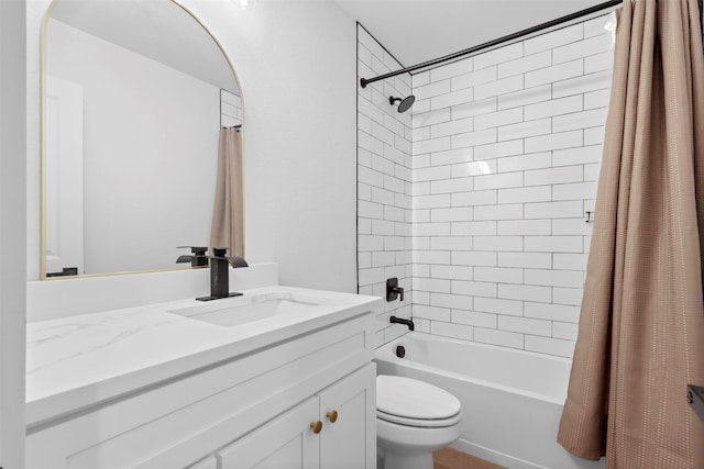 full bathroom featuring toilet, vanity, and shower / bath combo with shower curtain