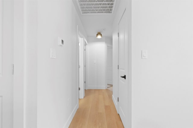 hallway with light wood-type flooring