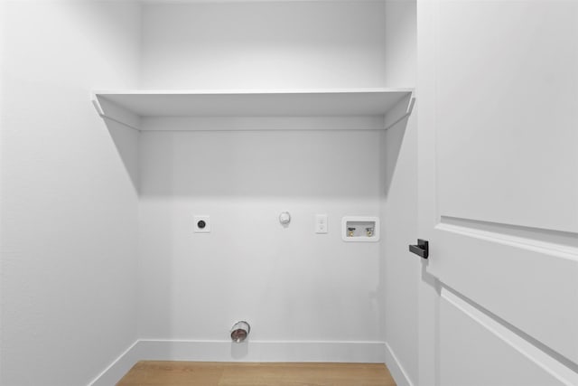 laundry area featuring electric dryer hookup, washer hookup, hardwood / wood-style flooring, and hookup for a gas dryer