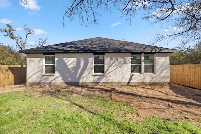 view of side of property with a yard