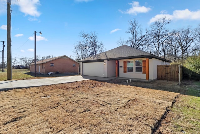 ranch-style home featuring a front yard and a garage