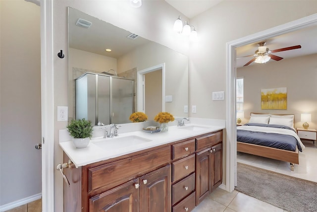 bathroom featuring tile patterned flooring, vanity, an enclosed shower, and ceiling fan