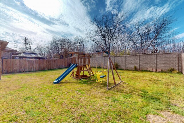 view of play area featuring a lawn