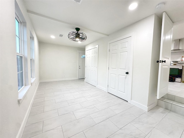 interior space featuring ceiling fan