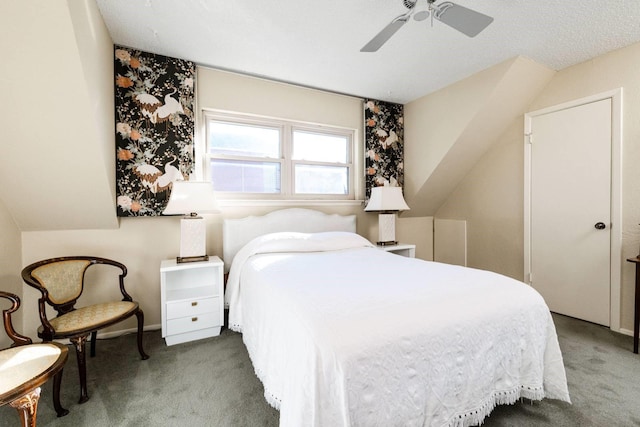 carpeted bedroom with ceiling fan and a textured ceiling