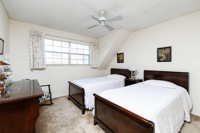 carpeted bedroom with a textured ceiling and ceiling fan