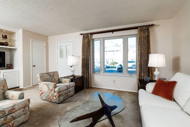 carpeted living room featuring a textured ceiling and built in shelves