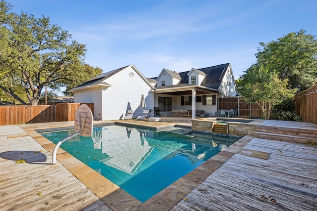 view of pool featuring a wooden deck