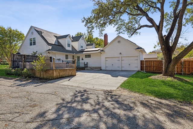 back of property featuring a garage