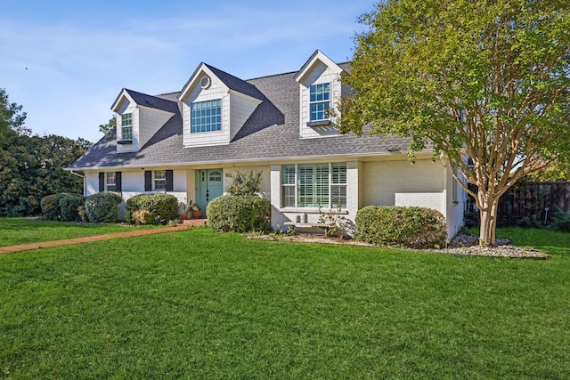 new england style home with a front yard