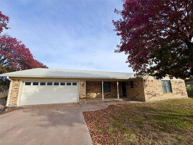 ranch-style house with a front lawn and a garage