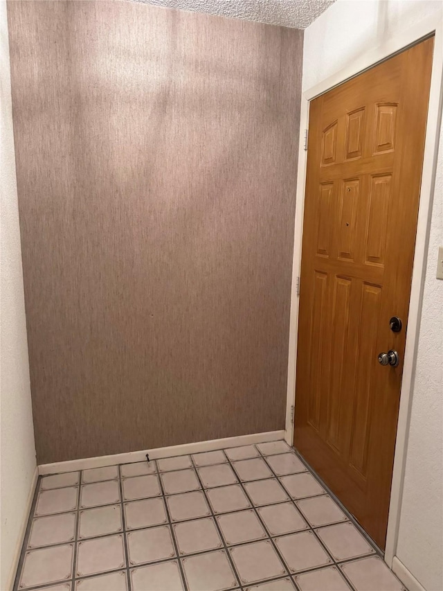 interior space featuring a textured ceiling