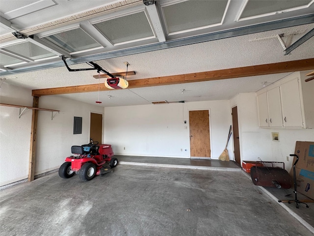 garage featuring electric panel and a garage door opener