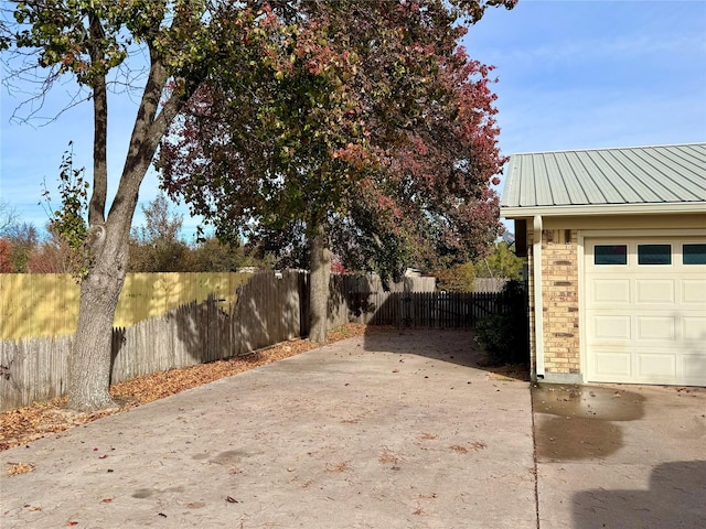 view of yard featuring a garage