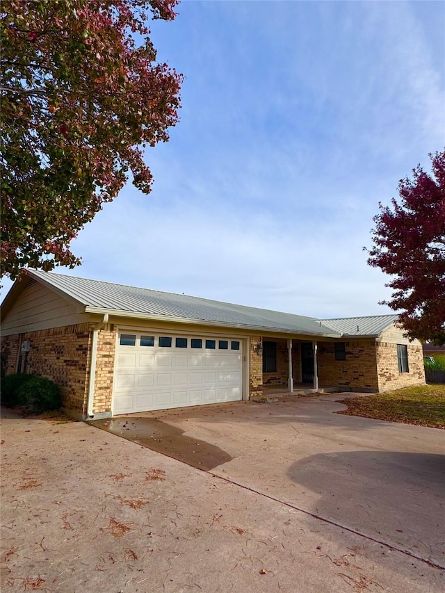 ranch-style home featuring a garage