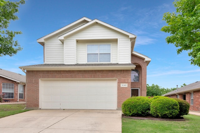 view of front of property featuring a garage