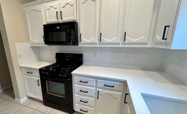 kitchen with black appliances, sink, white cabinetry, light tile patterned flooring, and tasteful backsplash