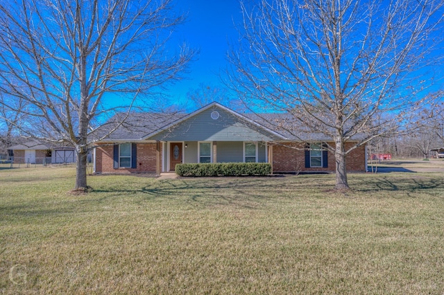 single story home featuring a front lawn