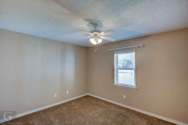 unfurnished room with a textured ceiling, ceiling fan, and carpet