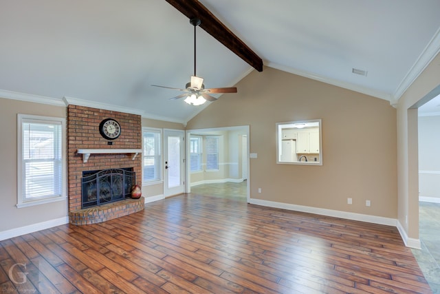 unfurnished living room featuring hardwood / wood-style flooring, ceiling fan, a fireplace, and ornamental molding