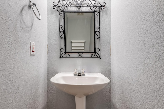 bathroom with a textured wall