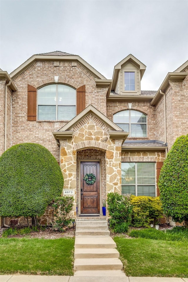 property entrance with a yard