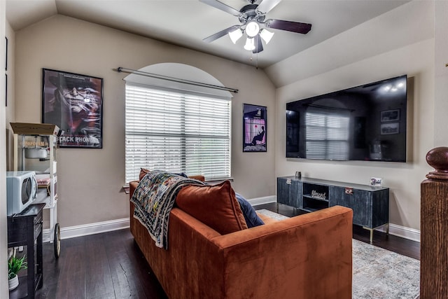 living room with ceiling fan, dark hardwood / wood-style flooring, and lofted ceiling