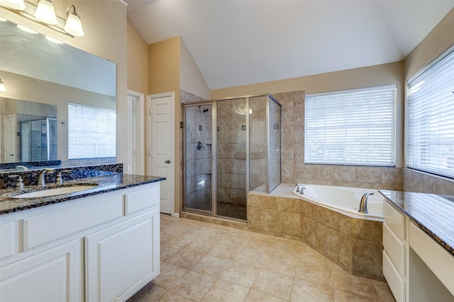 bathroom with lofted ceiling, vanity, tile patterned flooring, and independent shower and bath