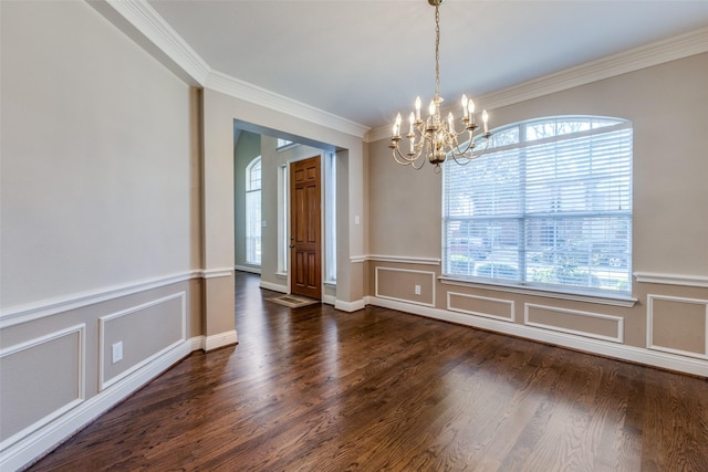 unfurnished dining area with a chandelier, ornamental molding, and dark hardwood / wood-style floors