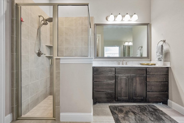 bathroom with tile patterned flooring, vanity, and a shower with shower door