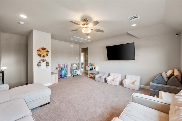 carpeted living room with ceiling fan