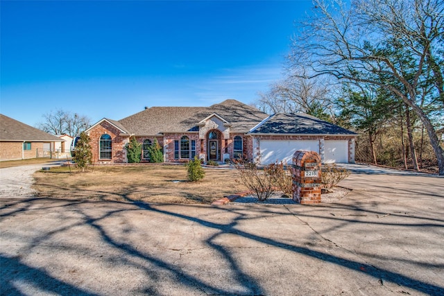 ranch-style home featuring a garage