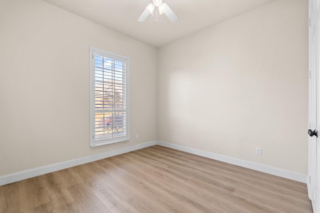 empty room with light hardwood / wood-style floors and ceiling fan