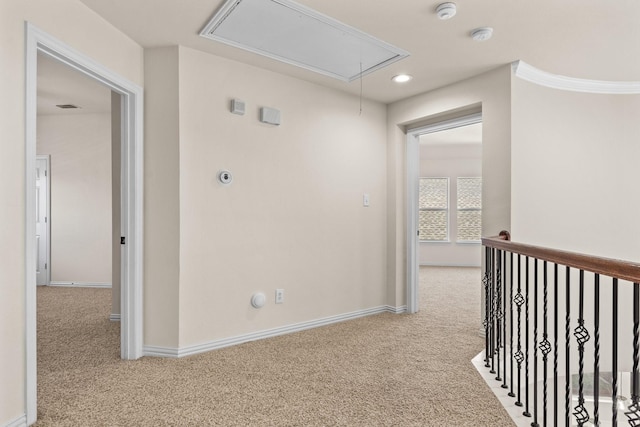 hallway featuring light colored carpet