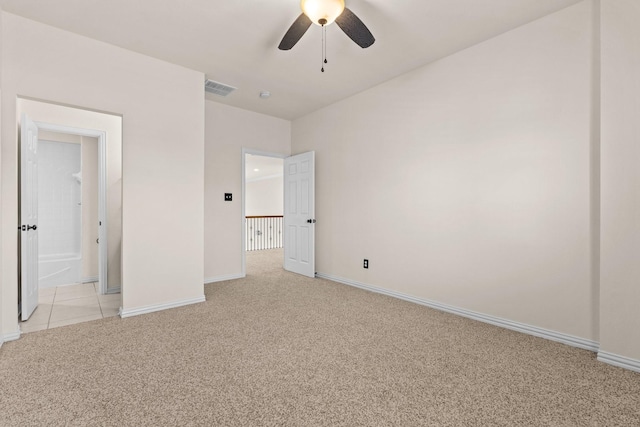 unfurnished bedroom featuring ceiling fan and light carpet