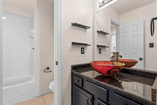 full bathroom with tub / shower combination, tile patterned flooring, vanity, and toilet