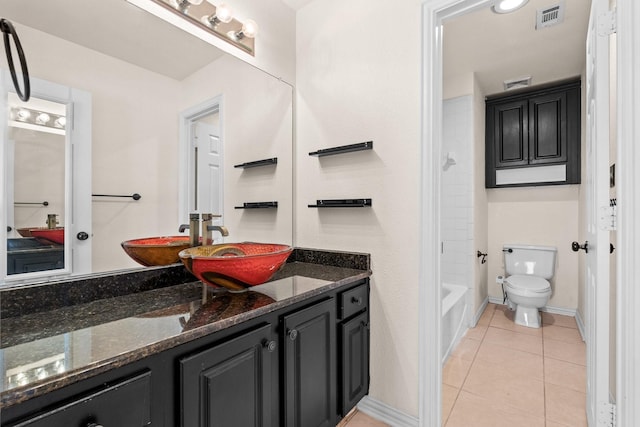 full bathroom with toilet, washtub / shower combination, tile patterned floors, and vanity