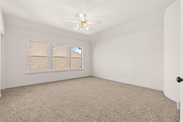 spare room with carpet floors and ceiling fan