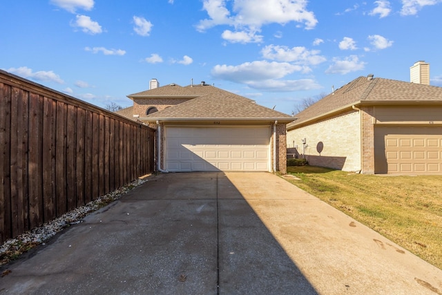 view of side of home with a yard