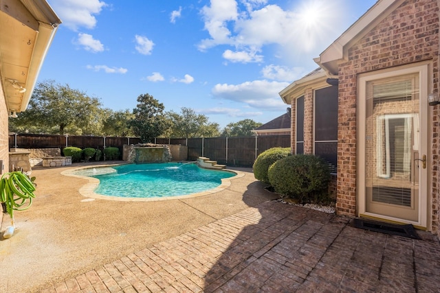 view of pool with a patio area and pool water feature