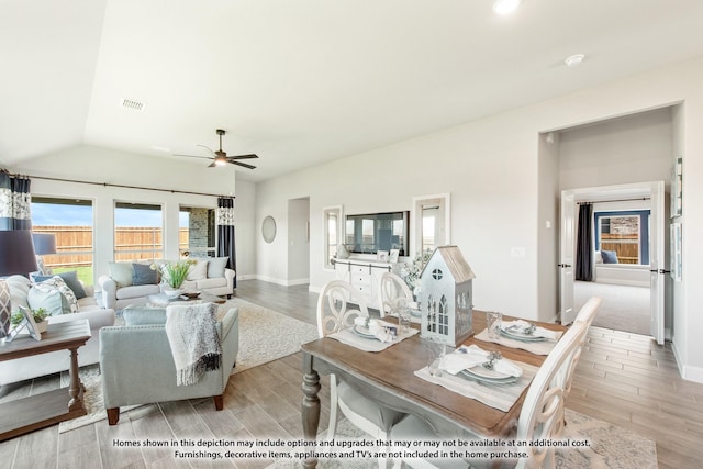 living room featuring lofted ceiling and ceiling fan