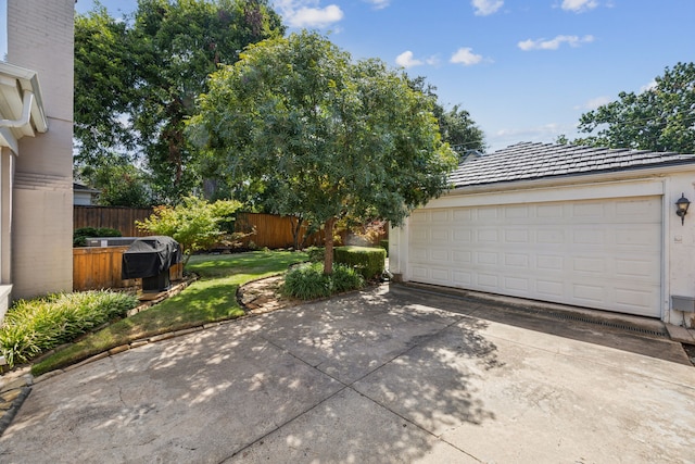 garage with a yard