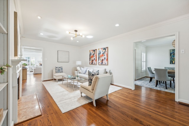 living room with a notable chandelier, dark hardwood / wood-style flooring, and crown molding