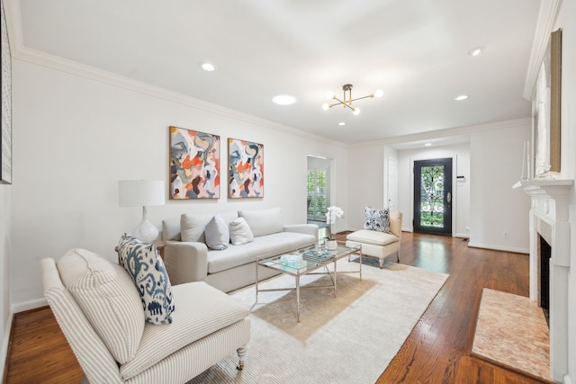 living room with a healthy amount of sunlight, crown molding, and dark hardwood / wood-style floors