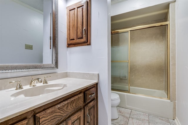 full bathroom featuring toilet, bath / shower combo with glass door, and vanity