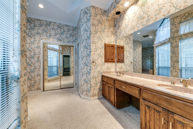 full bathroom featuring wallpapered walls, baseboards, and a sink