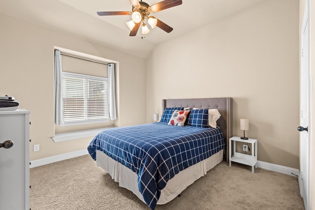 carpeted bedroom featuring ceiling fan and lofted ceiling