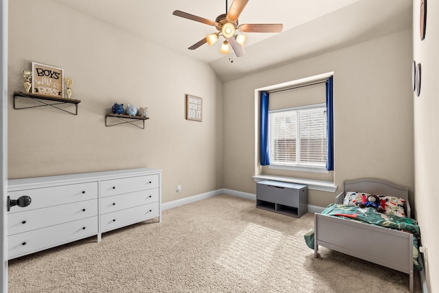 bedroom with lofted ceiling, ceiling fan, and light carpet