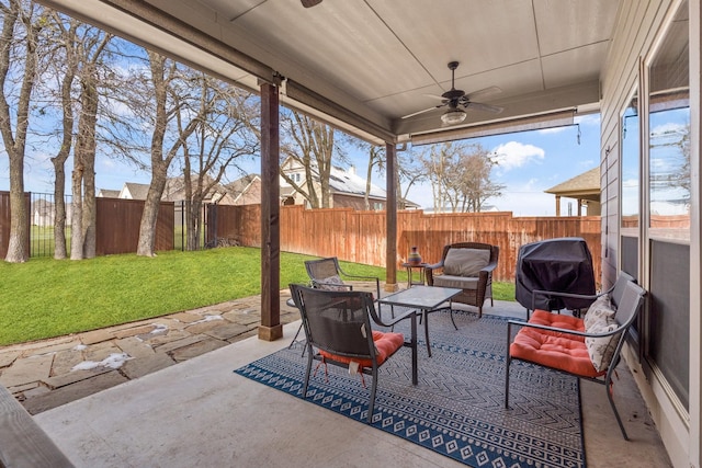 view of patio / terrace with ceiling fan and a grill