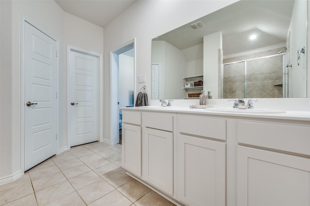 bathroom featuring vanity, walk in shower, and tile patterned floors